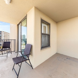 The balcony features a scenic view, offering a relaxing spot to enjoy the view of the surrounding area