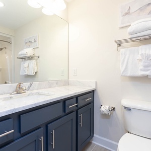 Rinse at the sink set in cool stone, grab a towel from the rack, and start your day