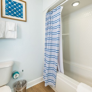 Stylish guest bathroom with soft towels and elegant decor that elevate your coastal retreat experience