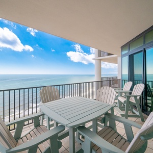 Relax on the spacious balcony with comfortable seating and breathtaking views of the tranquil waters and blue sky
