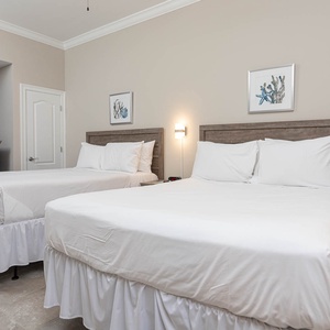 Relax on one of the cozy queen beds in this guest suite and enjoy a peaceful slumber