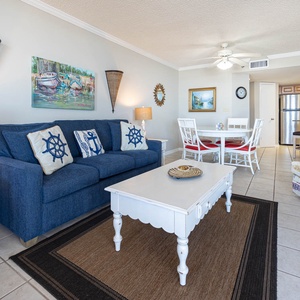 Unwind in the living area, featuring nautical decor and a sofa with queen sleeper