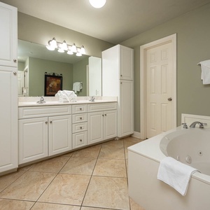 Refresh in the master bath after a day at the beach with a soothing jetted tub and relaxing walk-in shower