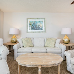 Unwind on the sofa with queen sleeper, surrounded by soft decor and natural light, perfect for relaxation