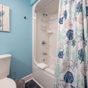 Freshen up in this guest bath in the relaxing shower or soothing tub before an exciting day