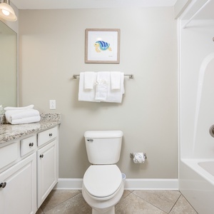 Freshen up in this guest bath in the relaxing shower or soothing tub before an exciting beach day