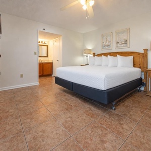 Relaxing master bedroom featuring a king bed, stylish decor, and an en-suite bathroom for your comfort