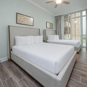 Relax on one of the cozy queen beds in this guest suite and enjoy a peaceful slumber