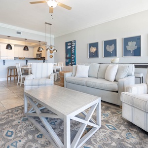 Relax in the spacious living area, where natural light fills the room while you enjoy cozy conversations