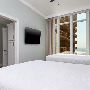 Unwind in this queen guest suite and stream your favorite shows or enjoy a good movie after a beach day