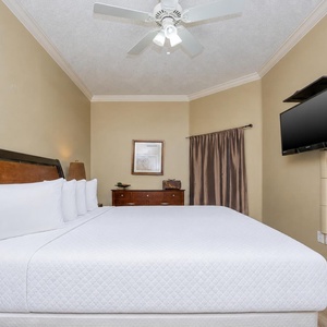 Drift into restful sleep on luxurious king bedding in this guest suite, surrounded by soothing decor and gentle coastal vibes