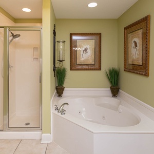 Indulge in relaxation in the master bath with a refreshing walk-in shower and soothing jetted tub