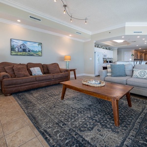 Gather in this welcoming living space and enjoy stunning panoramic beach views through the windows