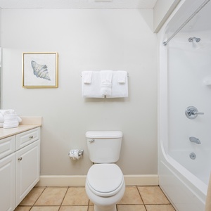 Freshen up in this guest bath in the relaxing shower or soothing tub before an exciting day