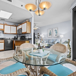 Gaze out from your cozy nook as sunlight dances across the glass dining table, igniting family laughter and joy
