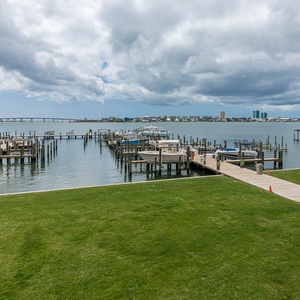 Stroll along the serene pathways, taking in refreshing breezes and picturesque views of the bay