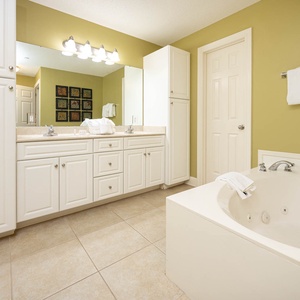 Refresh in the master bath after a day at the beach with a soothing jetted tub and relaxing walk-in shower