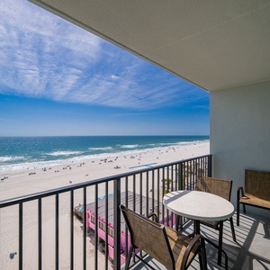 Your balcony invites you to savor the endless blue horizon and lively beach below