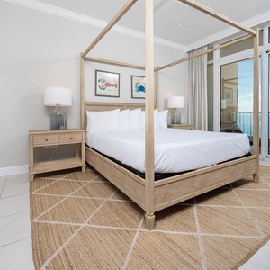 Retreat to the king master suite with cozy bedding and drift off to the sound of the waves from the balcony