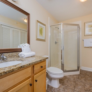 Refresh in this additional guest bath with a walk-in shower and laundry area with a washer and dryer in your rental
