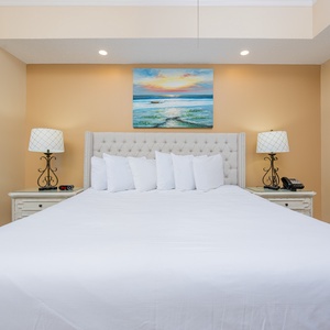 Unwind after a day at the beach in this elegant king master suite surrounded by stylish coastal accents