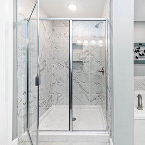 Enjoy a refreshing shower or relax in the soaking tub in the master bath after a day at the beach