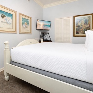 In the guest suite with a queen bed, you settle in while the TV plays your favorite shows