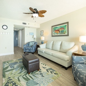 Plush leather sofa and starfish armchairs surround you for movie nights in the living room