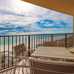 Relax on the balcony while enjoying sweeping views of the tranquil waters and coastline
