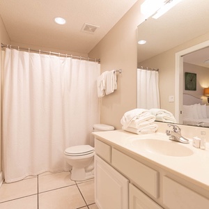 Refresh in this guest bathroom featuring a spacious vanity, ample towels, and a relaxing atmosphere for your comfort