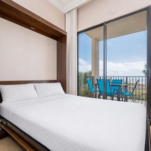 Relax in the cozy living area with a fold-down double bed and stunning views