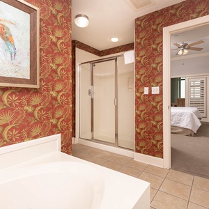 Refresh in the master bath after a day at the beach with a soothing jetted tub and relaxing walk-in shower