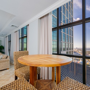 Savor moments at the cozy round table, enjoying the beautiful views while planning your beach adventures
