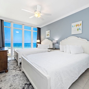 Lie back on two soft queen beds in the guest suite and watch the sun bounce across the gulf through tall windows