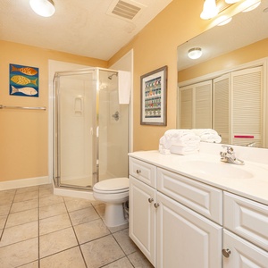 Refresh in this additional guest bath with a walk-in shower and laundry area with a washer and dryer in your rental