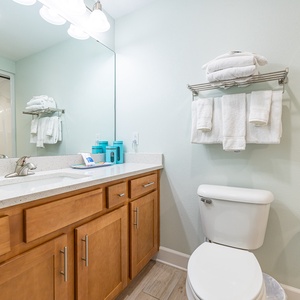 Freshen up in this guest bath in the relaxing shower or soothing tub before an exciting beach day