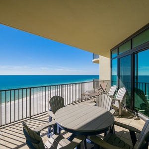 Bask in the sun on your balcony, enjoying breathtaking coastal views while unwinding in comfortable seating