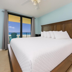 Enjoy a restful sleep on soft king bedding, with gentle coastal views inviting you to start your beach day