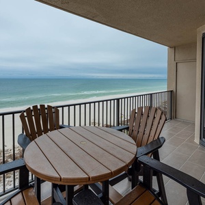 Savor meals or drinks at the patio table while enjoying expansive views of the tranquil waters and shoreline