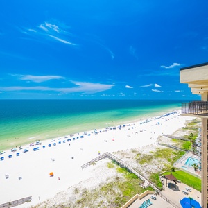 Enjoy views of the turquoise waters and serene beach from the balcony, perfect for a relaxing getaway