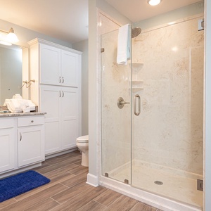 Refresh yourself in the spacious walk-in shower in the guest bath, enjoying the soothing vibe after a day on the coast