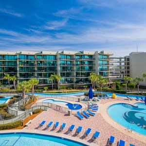 Soak up the sun while lounging by the sparkling pool, surrounded by vibrant greenery and gentle breezes