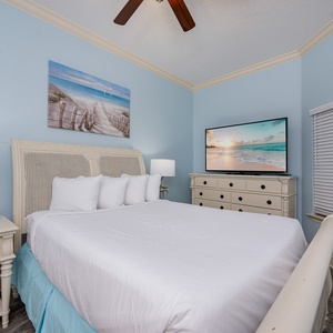 Drift into bliss on the soft queen bed, while watching your favorite shows on the large TV in this guest room
