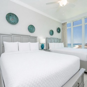 Wake to a breathtaking view in this queen guest suite with two cozy beds and expansive views