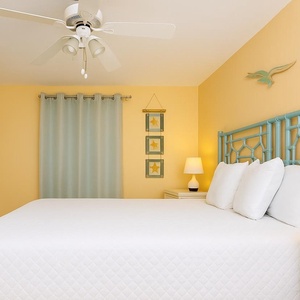 Enjoy a peaceful sleep on the queen bed as beach decor lends a calming vibe in your cozy getaway