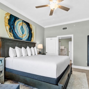Take in the vibrant artwork in the king master suite that complements the coastal vibe