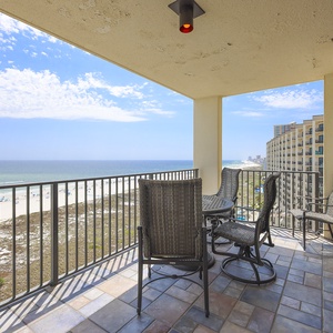 Balcony seating offers a perfect spot to enjoy the stunning beachfront view and gentle gulf breezes