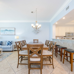 Gather around the dining table to share laughter and stories after a day of beachside fun in the living room