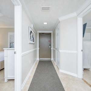 Welcoming entryway to your beachfront vacation retreat with views into the inviting king guest suites