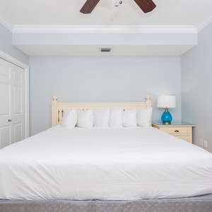 Drift into peaceful slumber in the king guest suite, embraced by the calming colors and gentle coastal decor